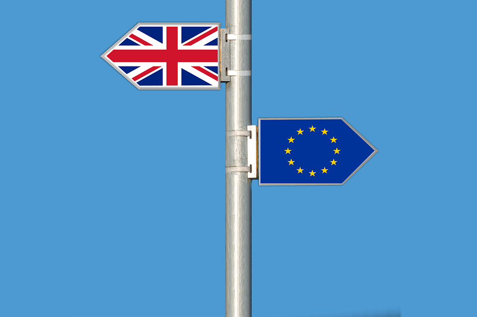 Road signs showing EU flag and Union Jack, symbolising Brexit